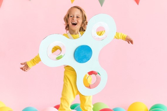 boy in fidget spinner costume