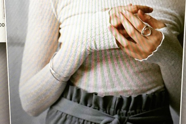 Close up of woman holding her own hands