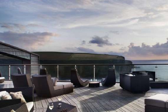 Decking with chair overlooking sea