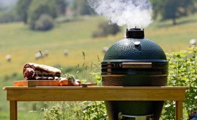 Big Green Egg shaped barbecue in a field