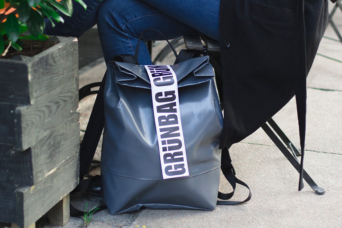 backpack on ground by woman