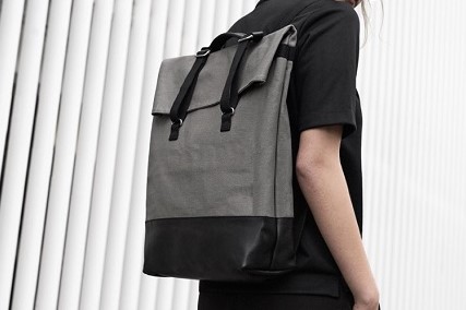 woman wearing black and grey backpack